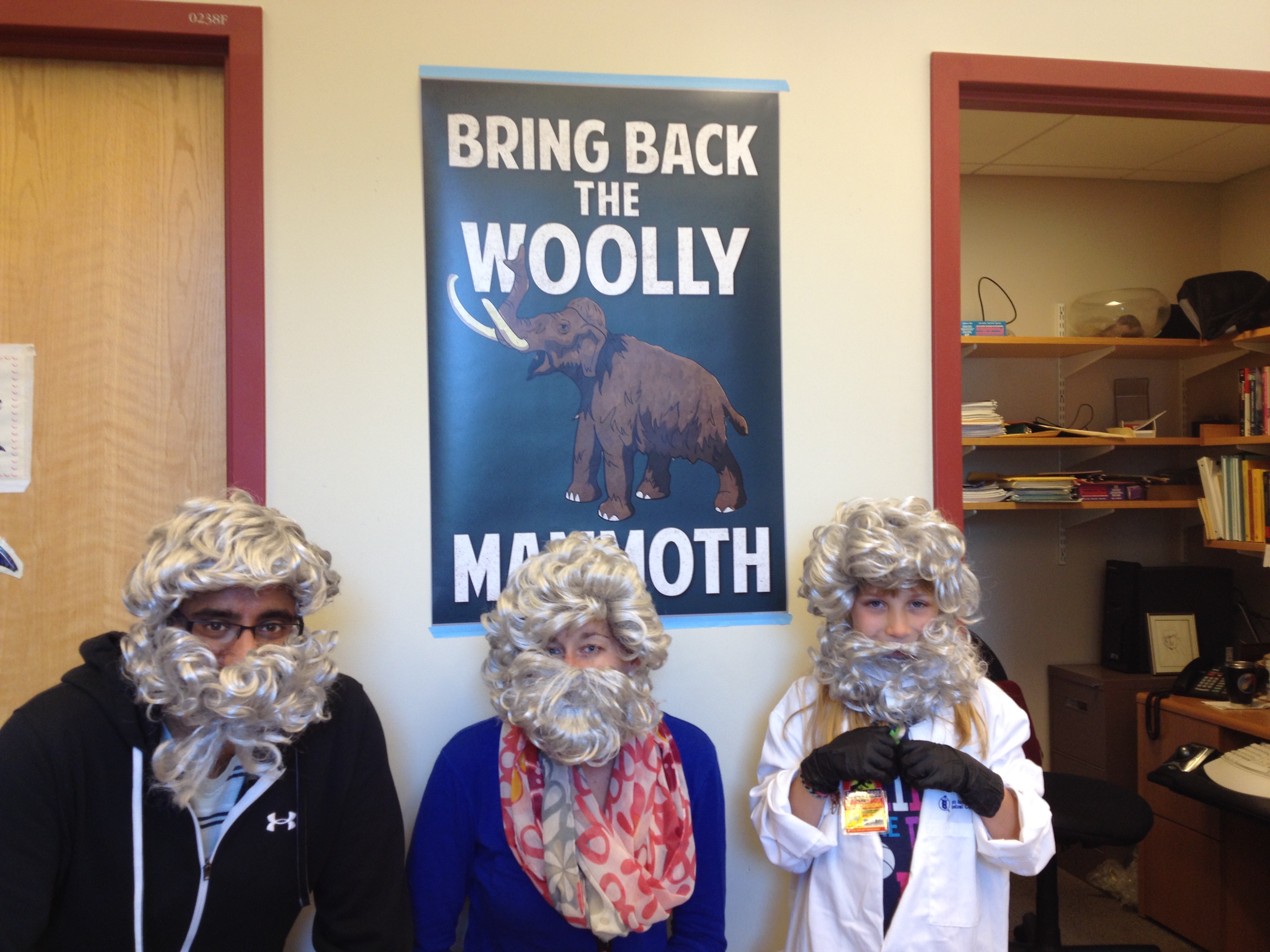 Scientists have fun in George Church beards with a young woolly mammoth enthusiast on a tour of the lab