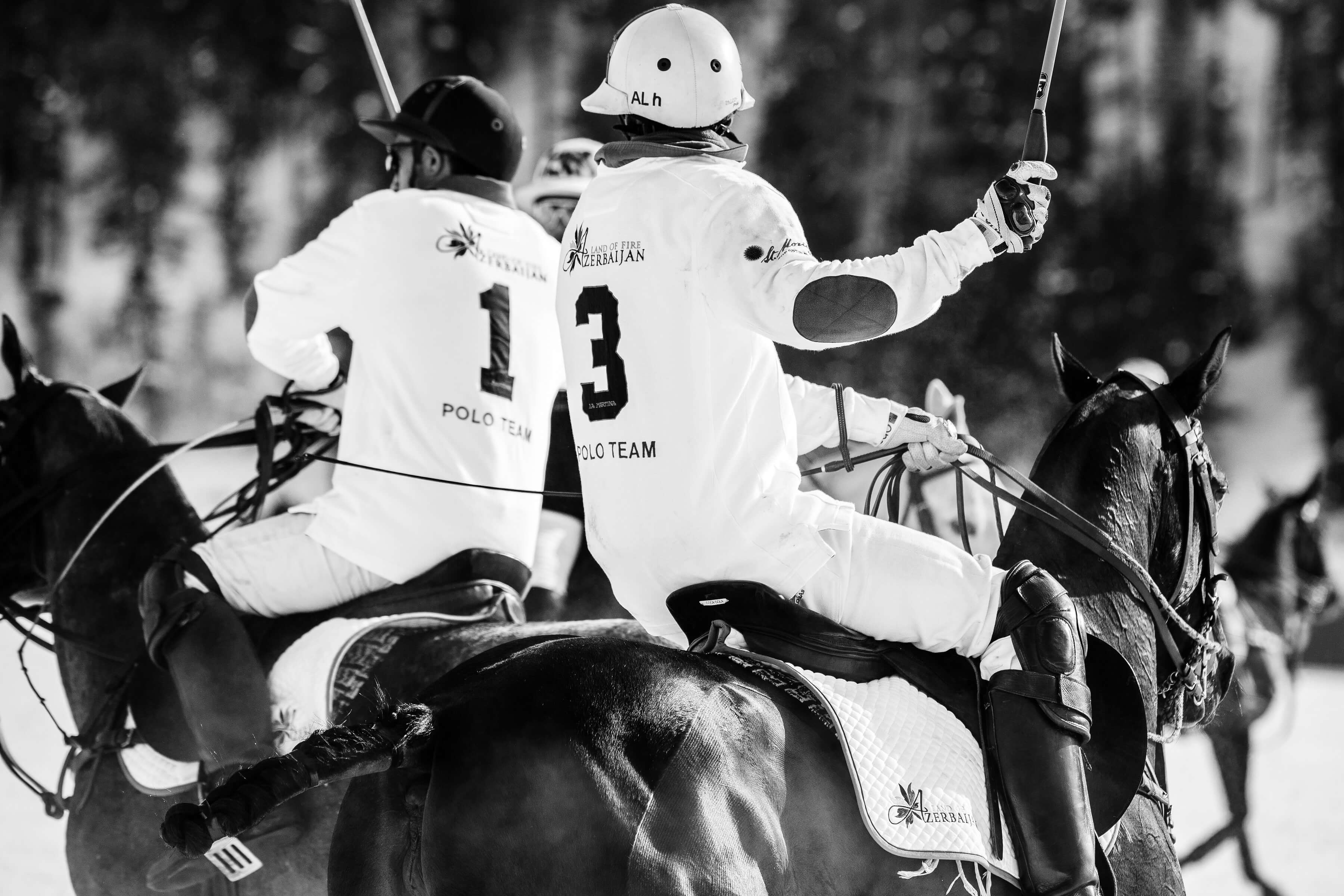 The Azerbaijan Land of Fire Snow Polo team get ready to play black and white