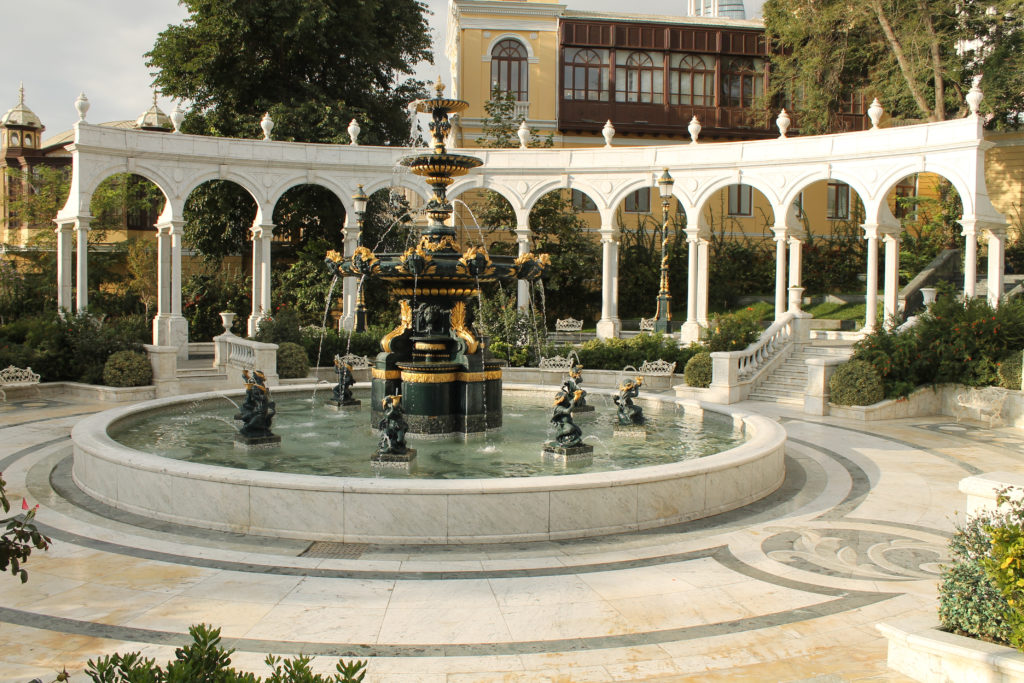 A courtyard with a fountain in the middle