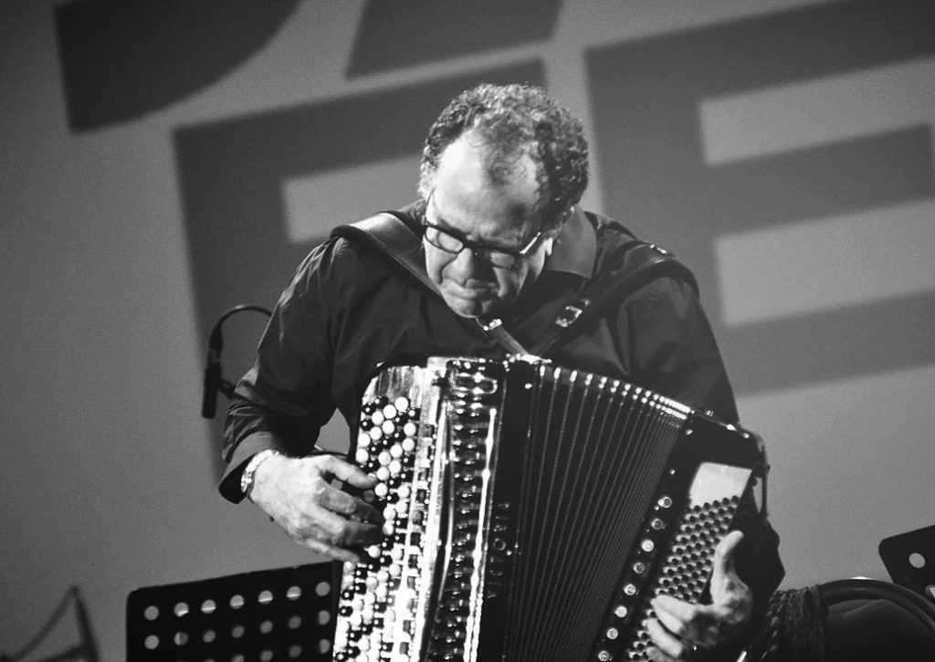 A man playing the accordion 
